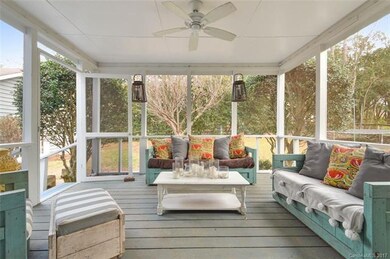 French Doors off the Den leads to the Screened Por
