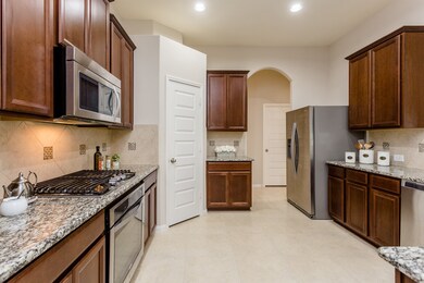What a fabulous kitchen! It offers so much space and has an abundance of cabinets.