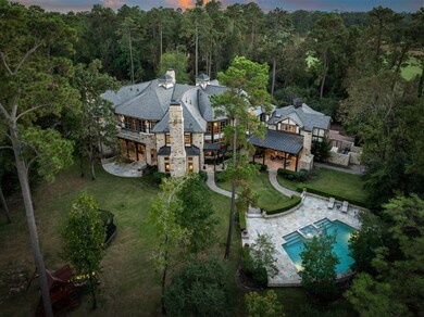 Nestled among towering trees, this estate is set b