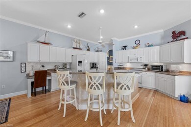 Kitchen featuring white appliances, visible vents,