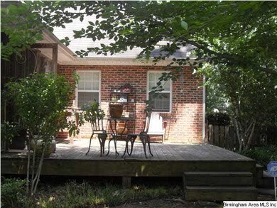 Open back deck with plenty of shade trees