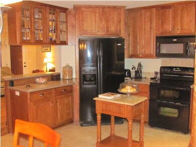 Kitchen floor to ceiling custom cabinetry, raised