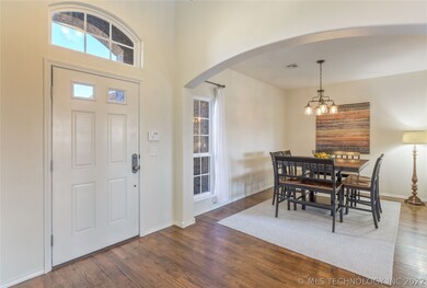 Formal dining with hardwoods has plenty of space f