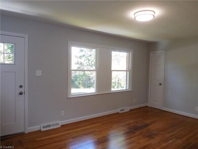 Spacious LR w/Hardwoods & tons of natural light.