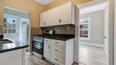 UPDATED CABINETRY & GRANITE COUNTERS