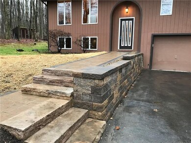 New stone steps, walkway and wall.