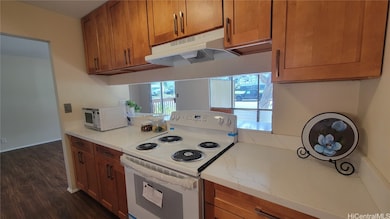 New range, range hood and microwave.