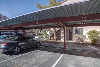 View of car parking featuring a carport