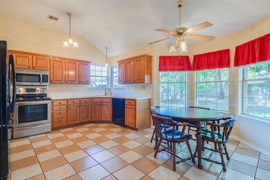 Kitchen with eat-in dining features large pantry,