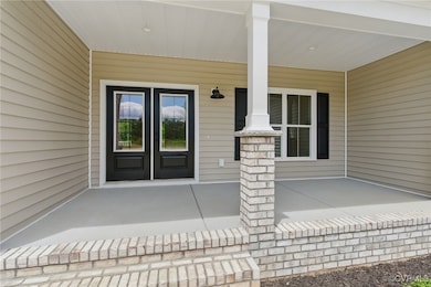 Doorway to property with covered porch and french