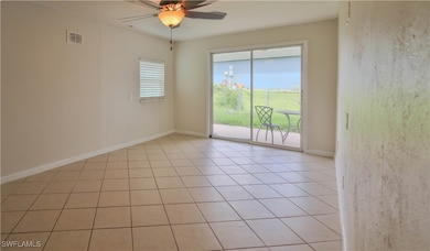 Empty room with ceiling fan, baseboards, and light