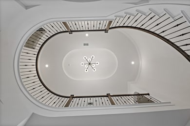 Elegant curved staircase, viewed from below. The c