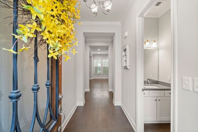 Grand entryway with high ceilings to welcome famil