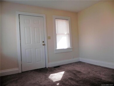 View from front door shows side door to side porch