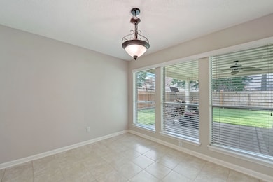 Formal dining room has view of the backyard.
