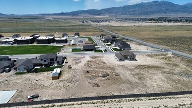 View of rural area with a mountain backdrop and nearby suburban area