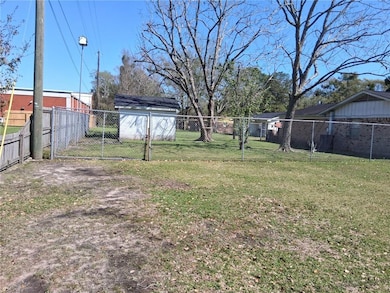 View of yard featuring a gate and fence