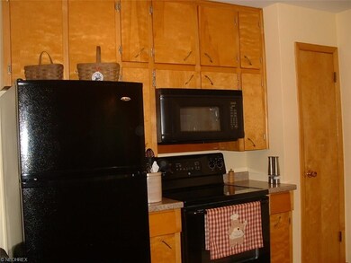 Lots of Kitchen cabinets, door to pantry, newer bl