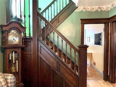 Beautiful original woodwork and wide stairs to the