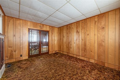 Antique beveled glass doors leading to dining room