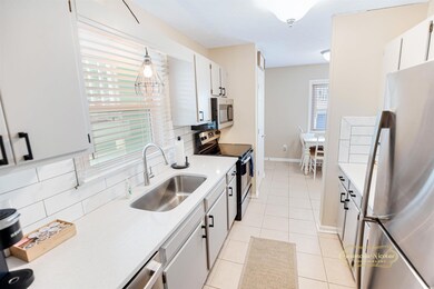 Kitchen featuring tasteful backsplash, stainless s