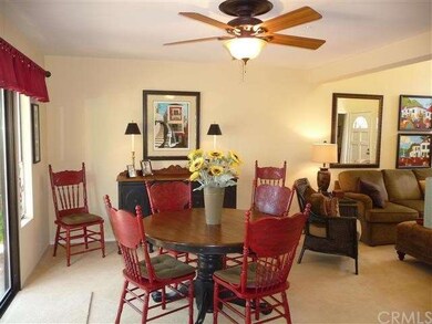 Dining Room with ceiling fan & access to patio
