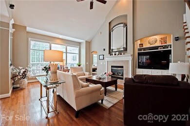 Great room with gas log fireplace and built-ins.