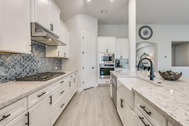 Kitchen featuring appliances with stainless steel