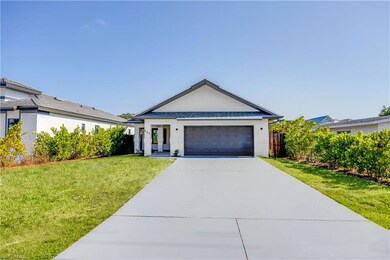 Ranch-style house with a garage and a front yard