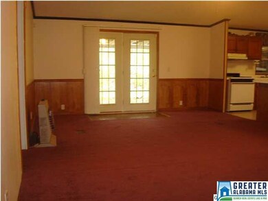 French doors leading onto the back porch/carport.