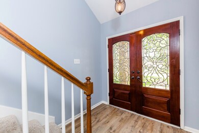 The Foyer is classic and refined, with double wood