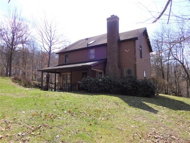 Back of house which features the covered back pati
