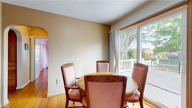 Dining room with sliders to the 2-level deck, look