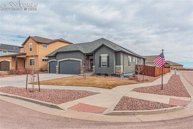 View of front of property featuring a garage