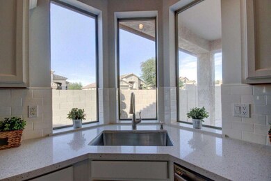 Lovely fixtures and backsplash!
