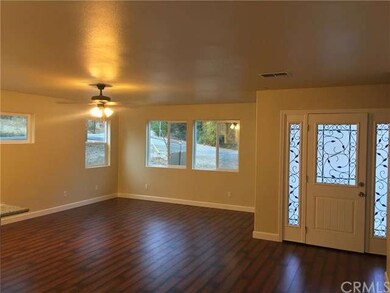 Warm and open with beautiful wood laminate floors,