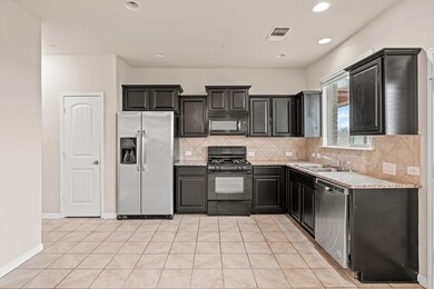 Kitchen featuring light tile patterned flooring, 