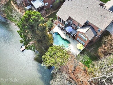 Overhead view of rear yard, pool and dock.
