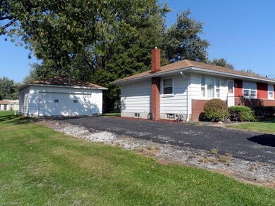 And a paved drive with full 2 car garage.
