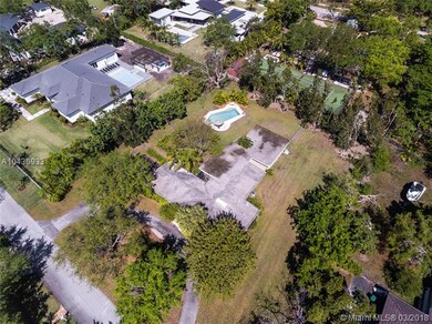 Aerial view of subject property and surrounding ho