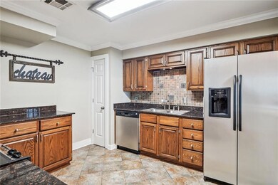 As you enter to the left is a kitchen more than one person can be in this kitchen