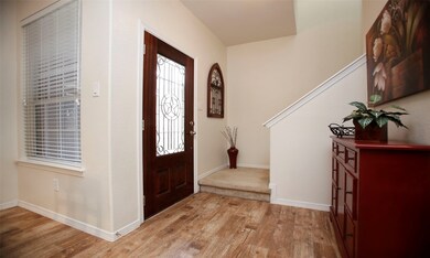 The front entry opens to the downstairs living spa