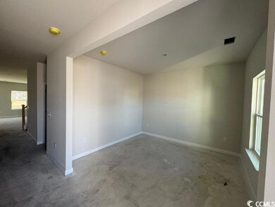 Spare room featuring concrete floors