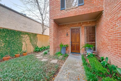 Enclosed front yard wraps around to the generous s