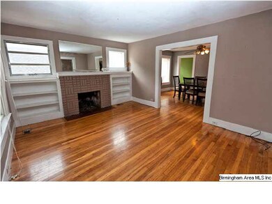 Living Room with Hardwood floors, fireplace and bu