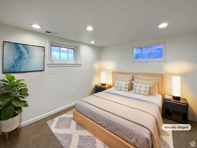 Carpeted bedroom featuring baseboards and recessed lighting
