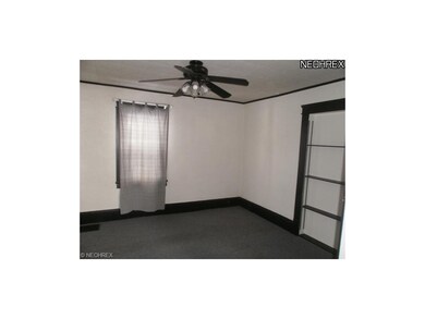 Living room area, wall to wall carpet, ceiling fan