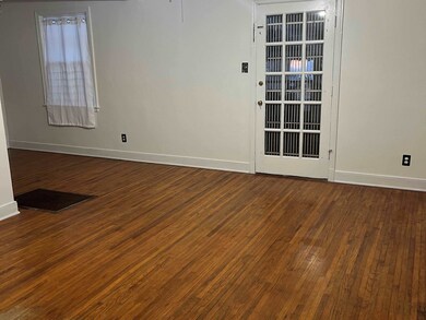 Unfurnished room featuring dark hardwood / wood-st