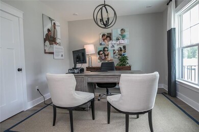 The first floor offers a large dining room with board and batten trim. The office has a closet and barn doors. Hardwoods throughout most of the downstairs. Spacious first floor guest suite. DESIGNER Kitchen with huge quartz island and walk-in pantry.