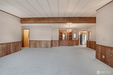 The Dining Room flows from the Living Room and features built-in cabinetry.